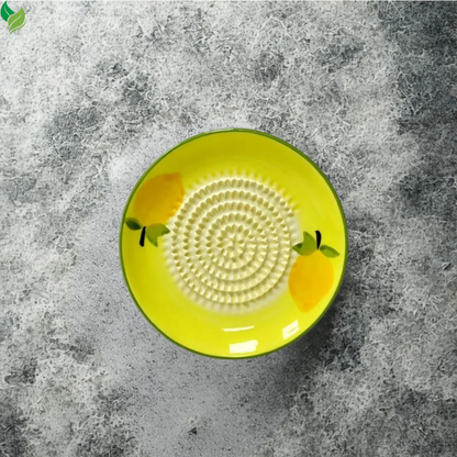 Freshly grated ginger and juice collected around the ceramic grater