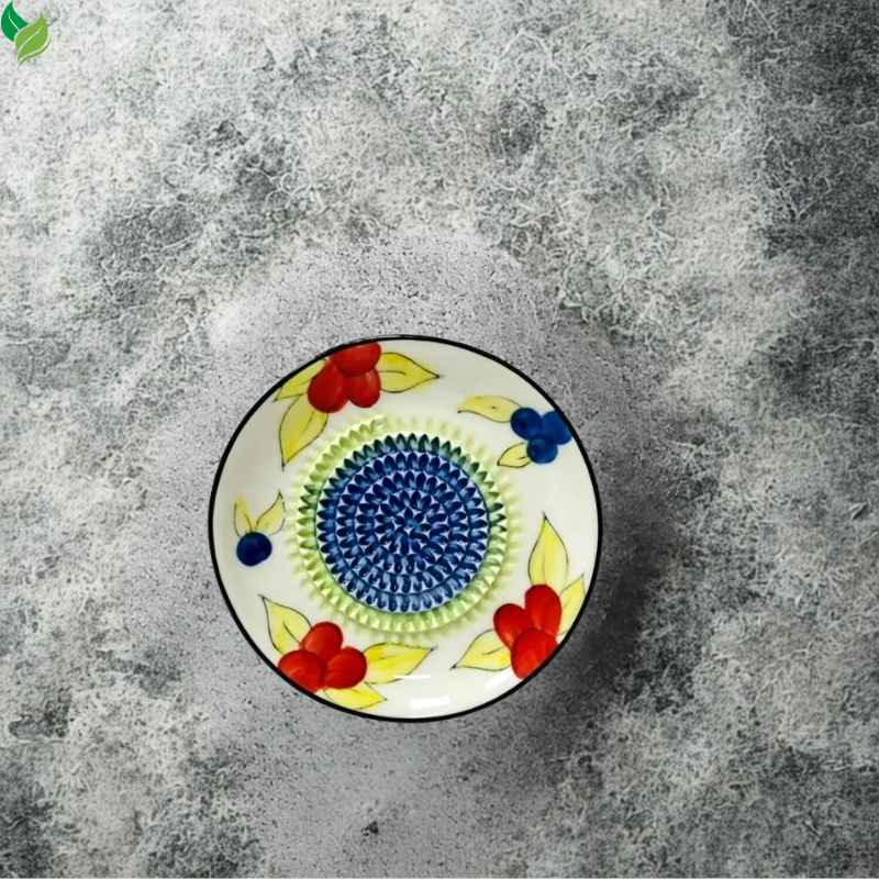 Ceramic ginger grater used to prepare seasoning for a homemade sauce