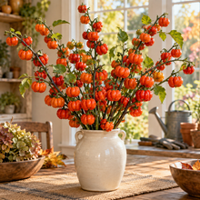 Pumpkin on a Stick ornamental eggplant branches displayed as an autumn centerpiece