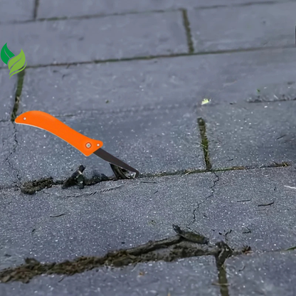 Orange patio weeding knife clearing debris between concrete pavers