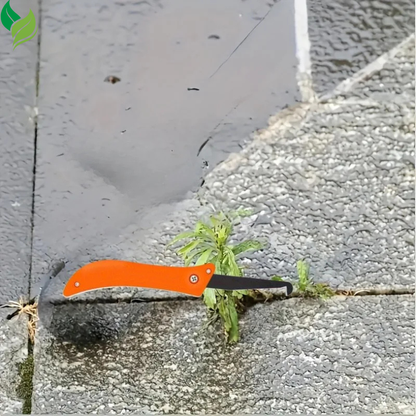 Folding crevice weeder removing a small weed beside a patio edge