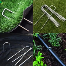 alvanized landscape staples securing fabric