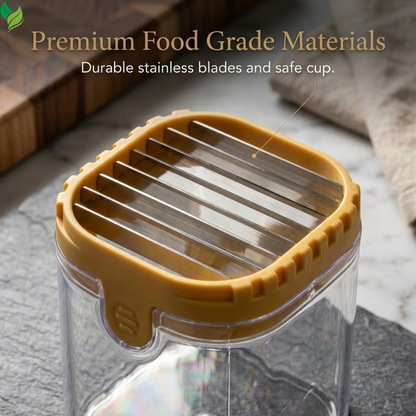 Compact fruit slicer held in one hand to show its small size