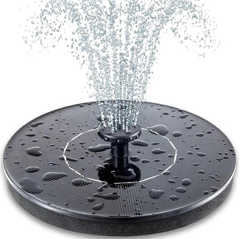 Solar-powered fountain pump creating a water feature in a bird bath