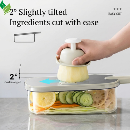Angled vegetable slicer cutting cucumber into a clear collection container