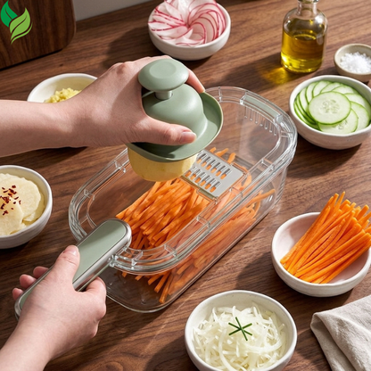 Green vegetable slicer shredding carrots into a clear collection basket