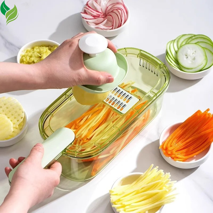 Green vegetable slicer shredding carrots in a bright kitchen prep scene